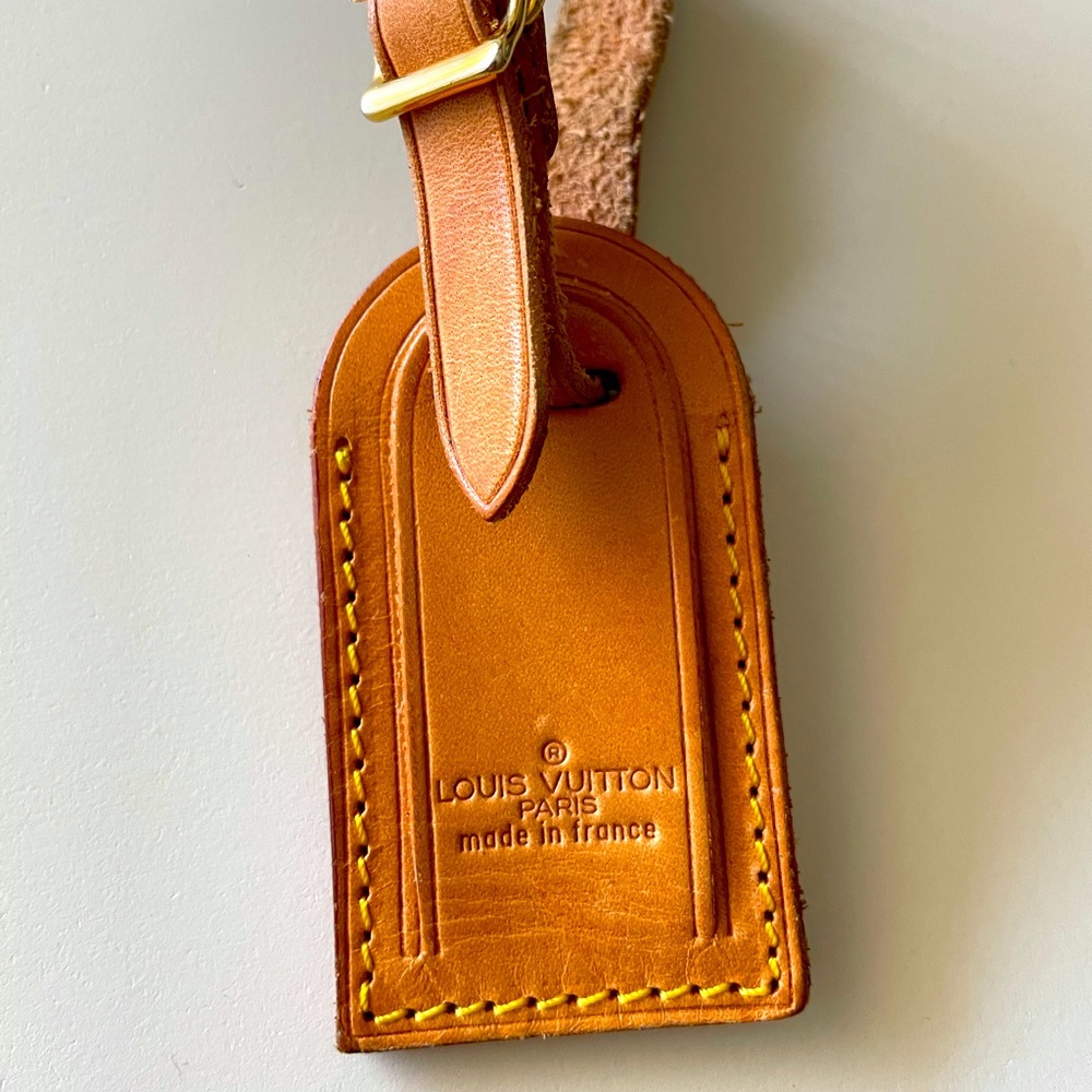 Authentic Louis Vuitton suit case tag